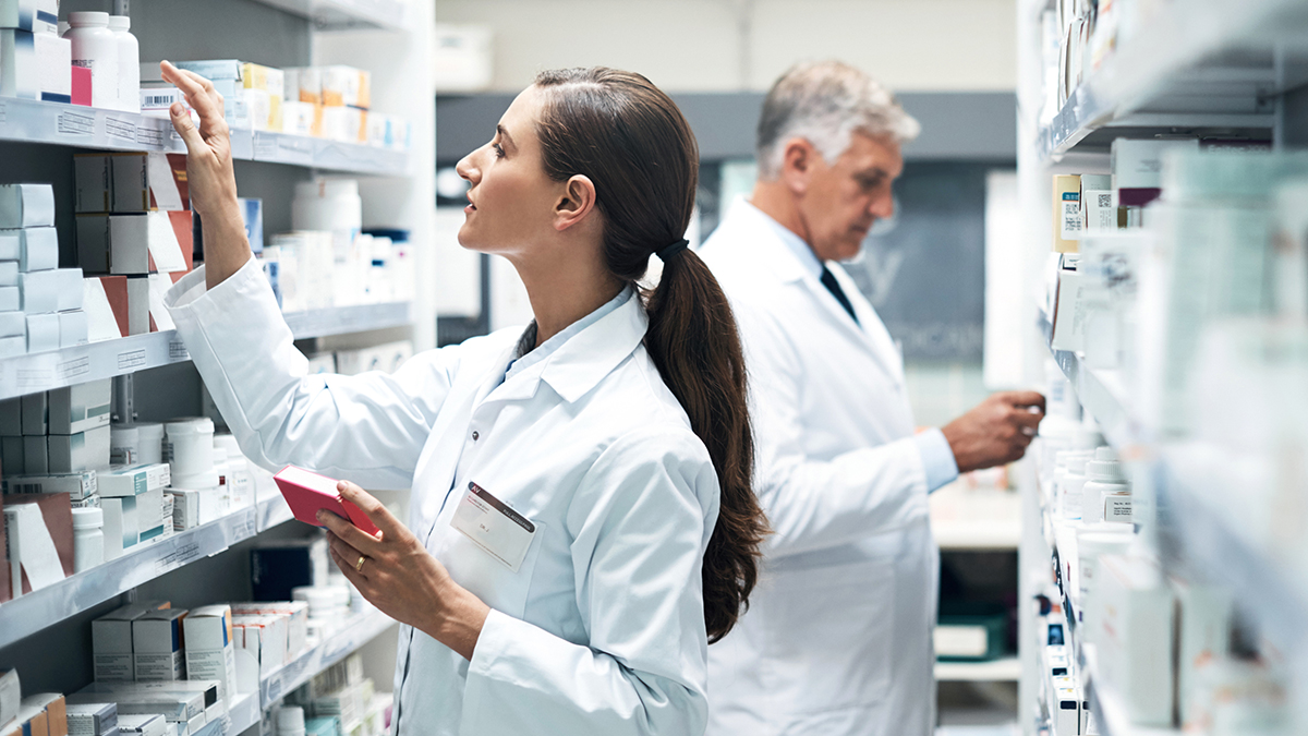 Cropped shot of two pharmacists checking products while working together in a dispensary