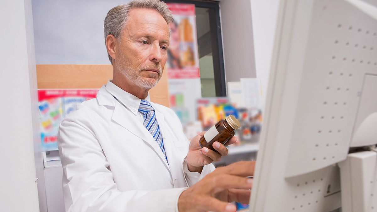 pharmacist checking medication