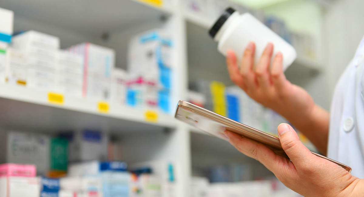 pharmacist looking at bottle
