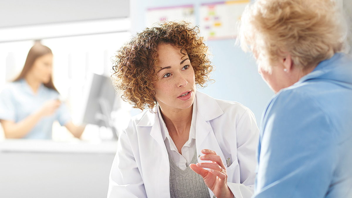 pharmacist with patient