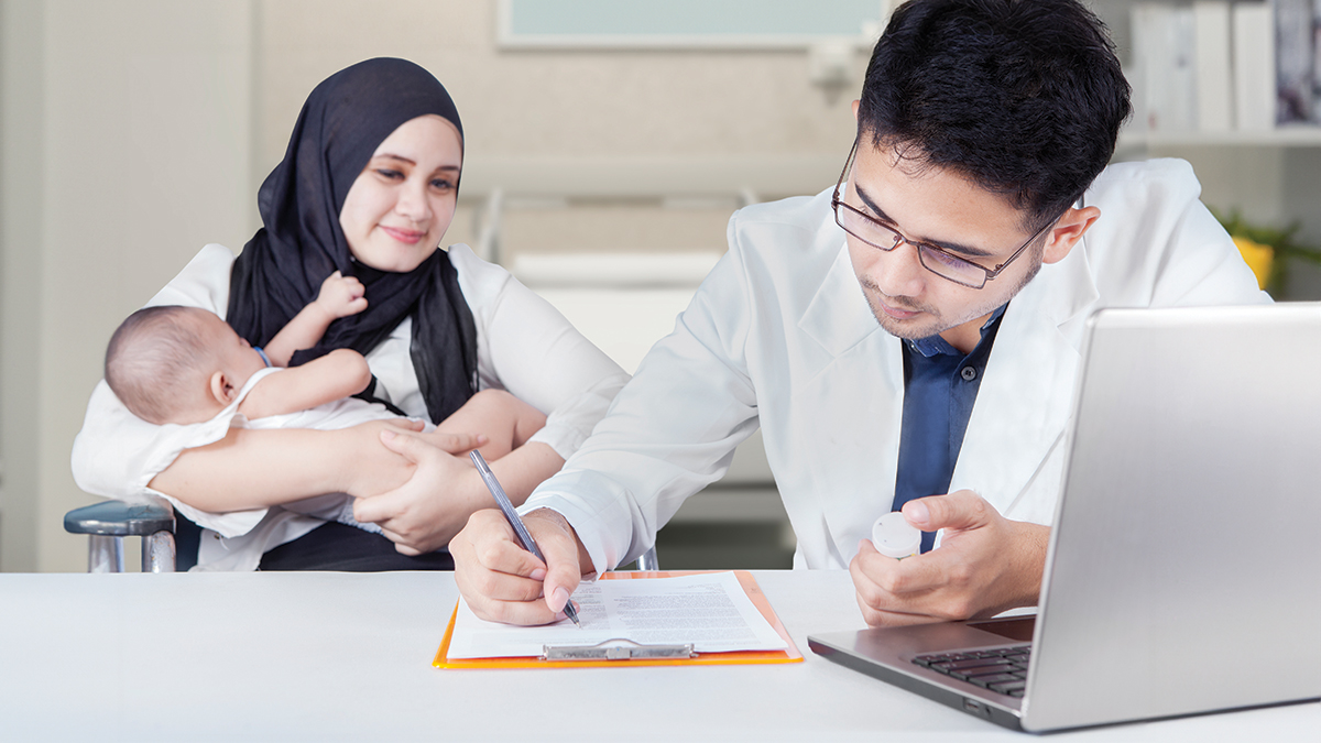 pharmacist with mother and baby