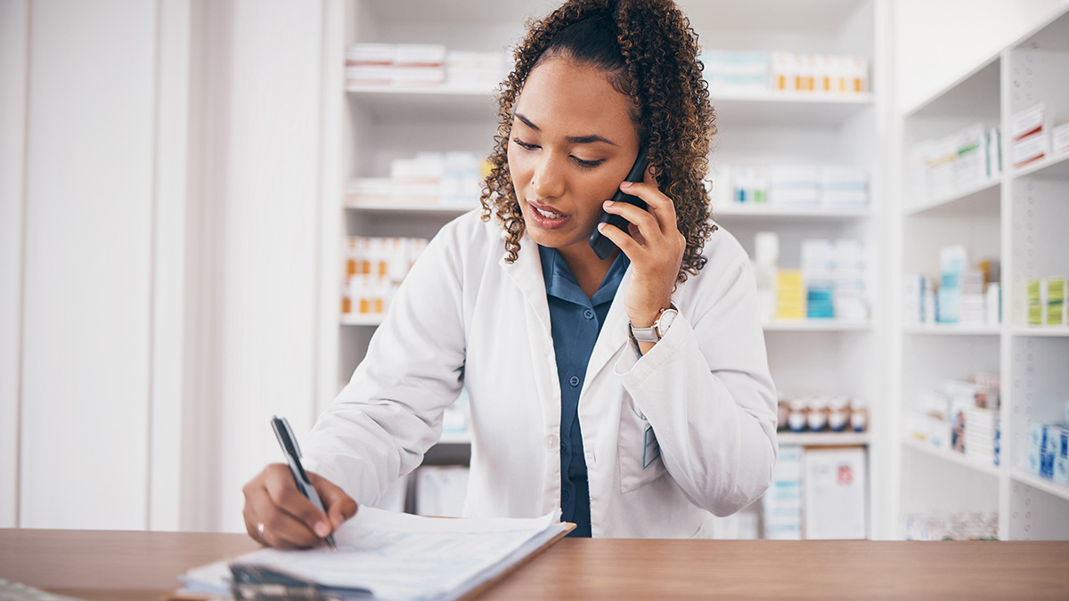 pharmacist woman and writing on medicine checklist
