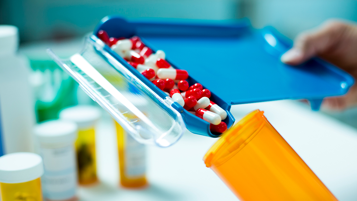 pills going into a bottle