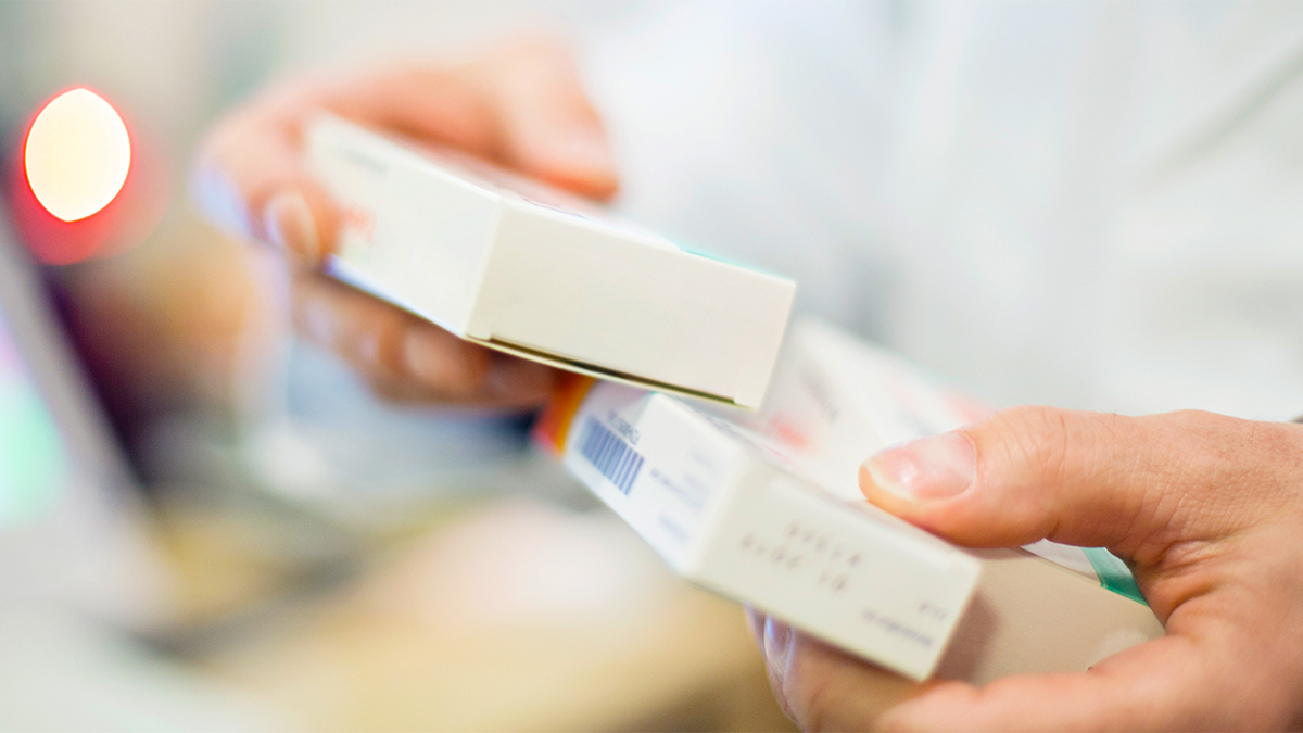 pharmacist looking at labels