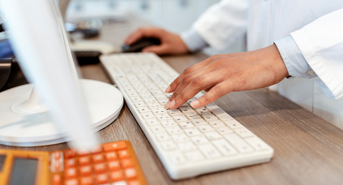 pharmacist at keyboard