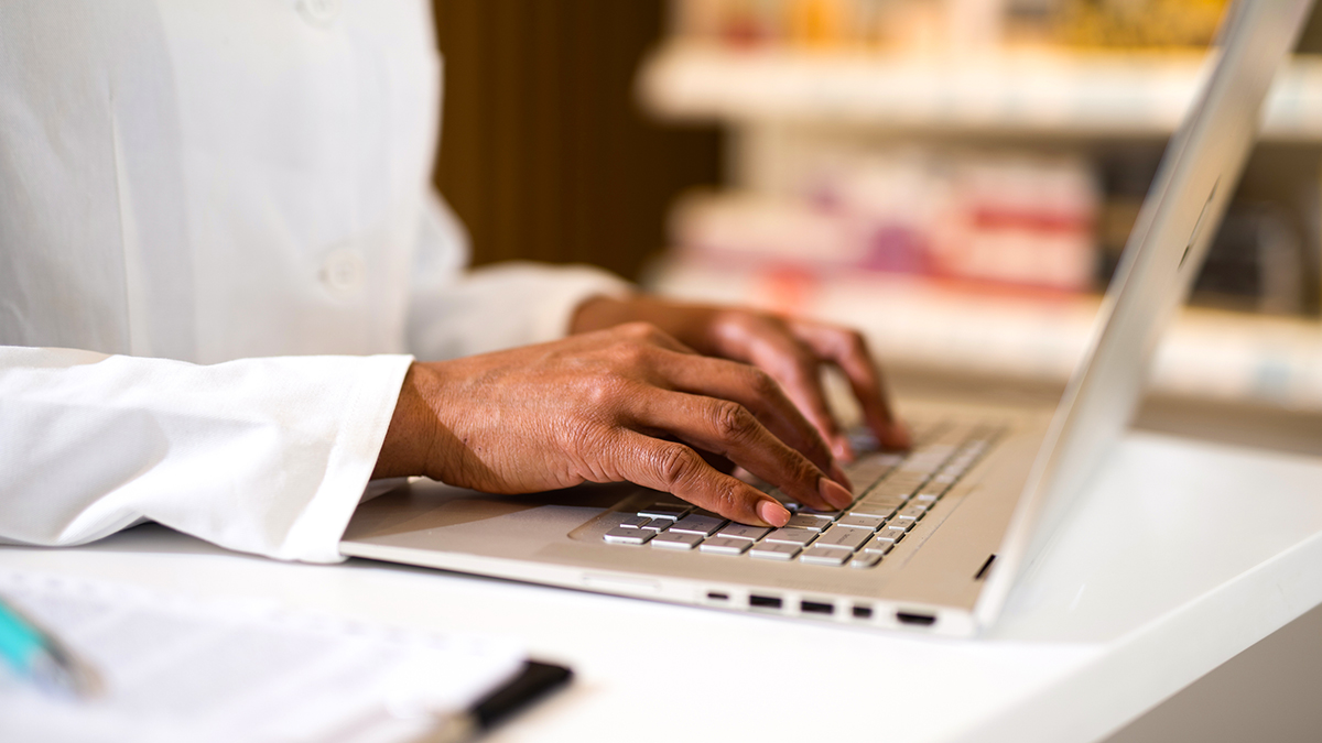 pharmacist at keyboard