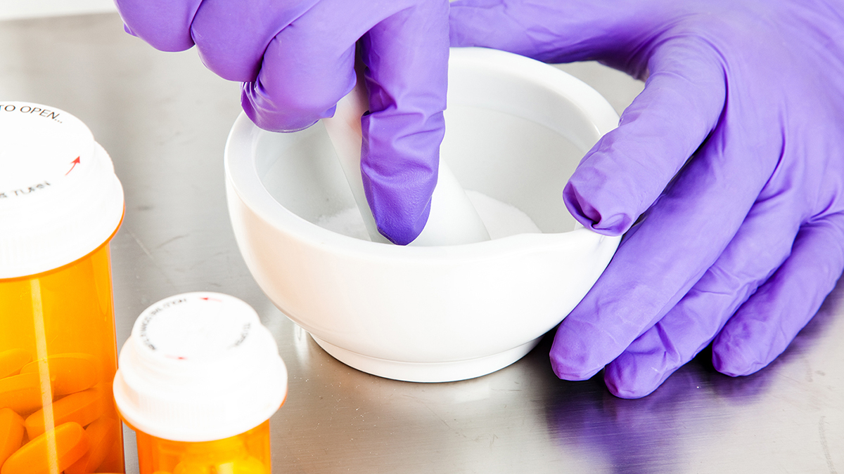 pharmacist with mortar and pestle