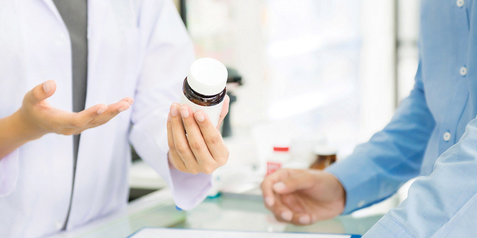 pharmacist talking to patient about medication