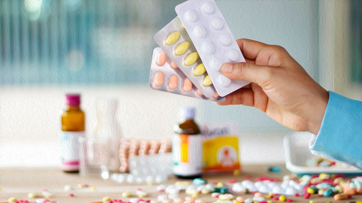 pharmacist holding medication
