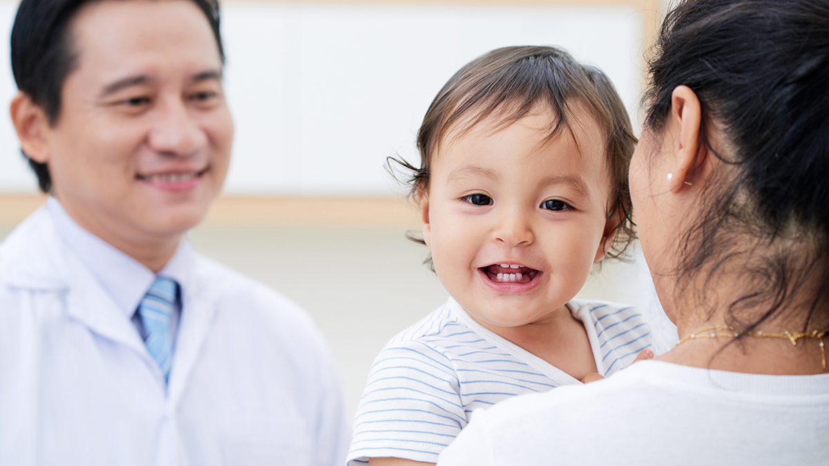 pharmacist with patient and baby