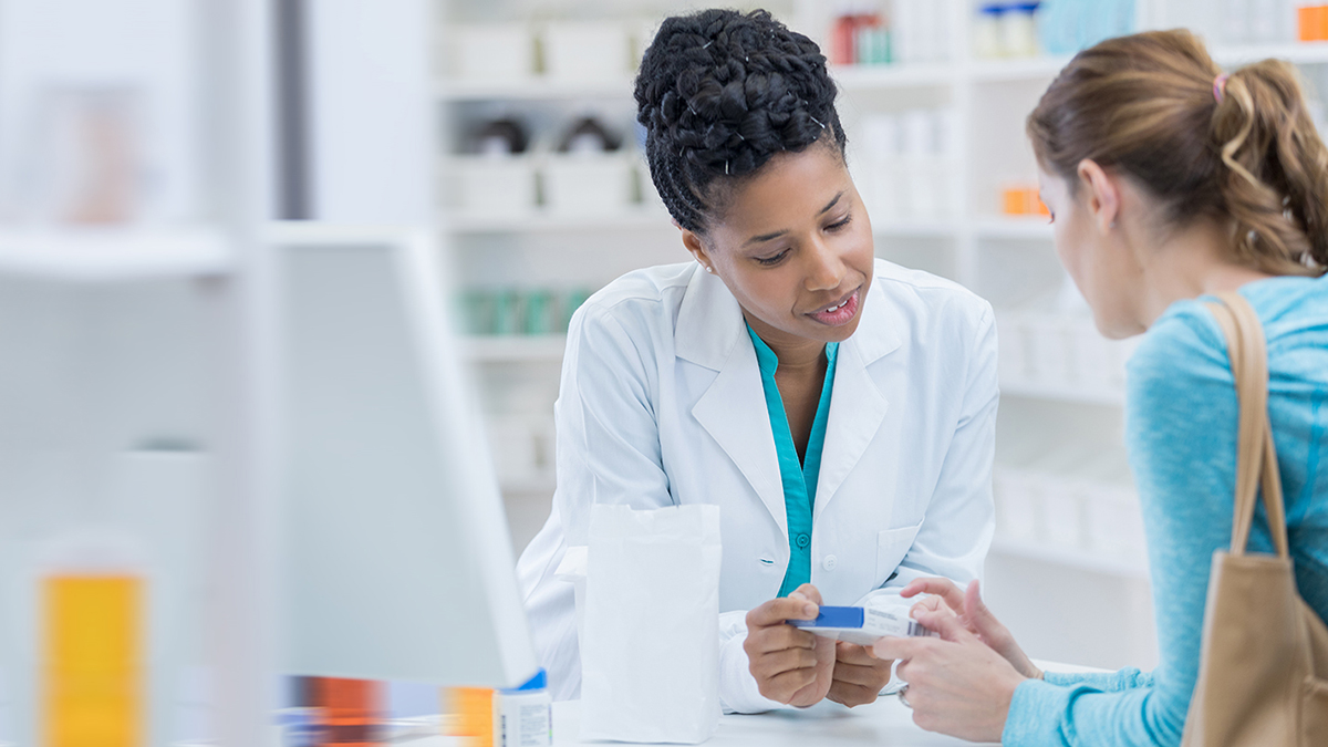 pharmacist with patient