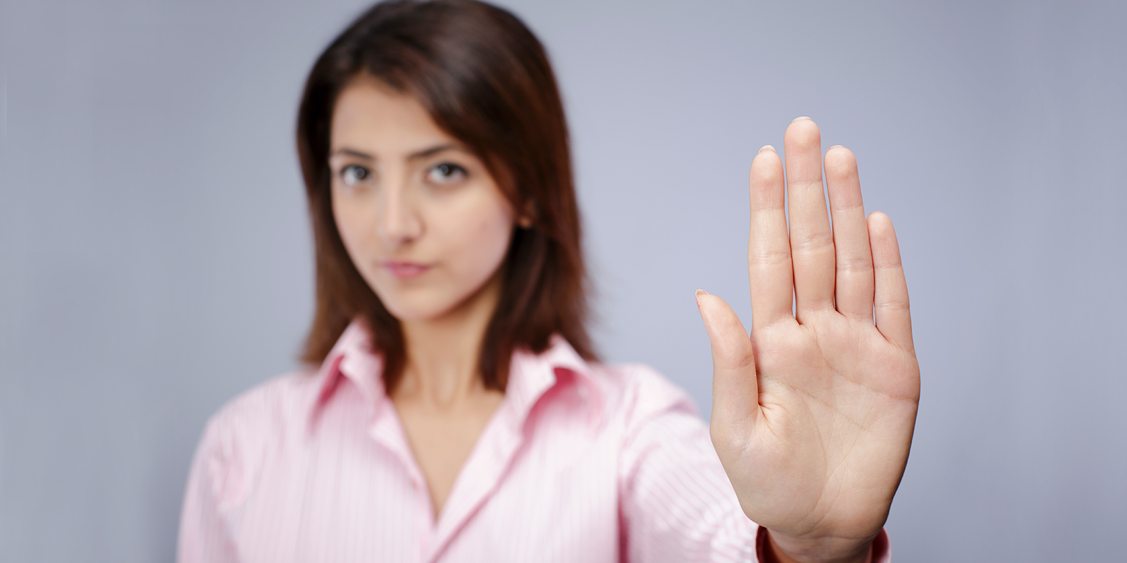 women with hand in raised