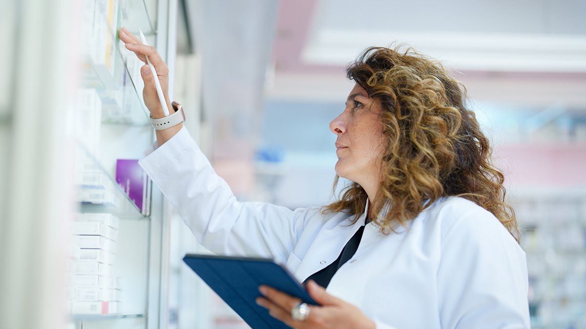 pharmacist with tablet